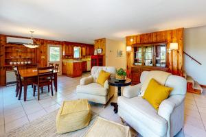 a living room with two couches and a table at Dog-friendly beach house with WiFi, private washer/dryer, deck, beautiful views in Bristol