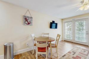 a dining room with a table and chairs at New Condo w/Water-View Deck in Edgecomb in Edgecomb