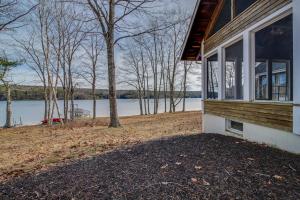 a house with a view of a body of water at Private waterfront home with large deck & deep water dock in Georgetown