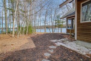 an empty porch of a house with a view of the water at Private waterfront home with large deck & deep water dock in Georgetown +18 photos