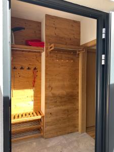 a room with a closet with wooden walls at Apartment 225 in Forstau