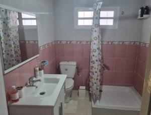 a bathroom with a sink and a toilet and a shower at home byrsa in Douar ech Chott