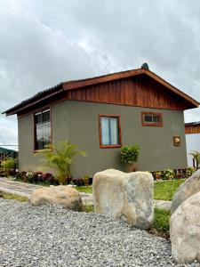 a small house with rocks in front of it at Kokoro Garden in Fortuna