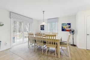 a dining room with a table and chairs at Secluded Dog-Friendly Getaway w/ Free WiFi, Private Washer/Dryer, Furnished Deck in Southport
