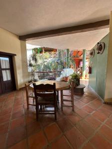 a dining room table and chairs in a house at Hotel Artesanal Palomera in San Francisco