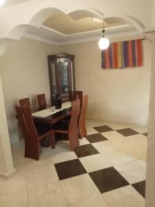 a dining room with a table and chairs at Duplex pres de la mer a Alger in Rouiba +13 photos