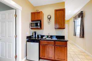 a kitchen with a sink and a microwave at Cozy & Clean Second-Story Suite w/ Kitchenette & Free WiFi - Walk to the Harbor in Northeast Harbor