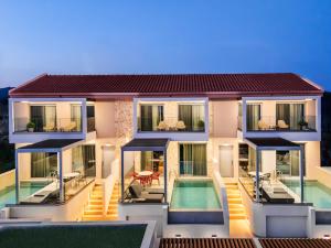 a rendering of a house with a swimming pool at Merivian Seaside Suites in Kanali