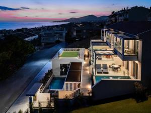 an aerial view of a house at night at Merivian Seaside Suites in Kanali