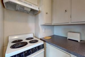 a kitchen with a stove and a counter top at Lovely studio w/full kitchen/free WiFi- next to river/antique shops/restaurants in Wiscasset