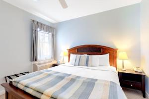 a bedroom with a large bed and a window at Cozy & Clean Second-Story Suite w/ Kitchenette & Free WiFi - Walk to the Harbor in Northeast Harbor +5 photos
