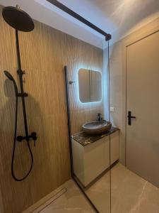 a bathroom with a sink and a mirror at Bella Villa in Proástion +75 photos