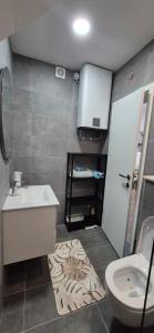 a bathroom with a sink and a toilet at Rooms Lami in Dubrovnik +53 photos