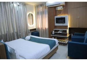 a hospital room with a bed and a tv at Shree Sanmat Guest House in Gwalior