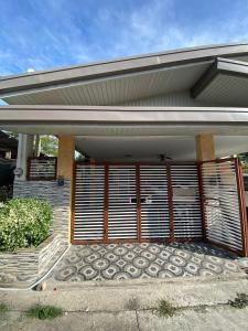 a front door of a house with a gate at Hermosa Traveler's Corner in Culis