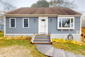 a blue house with a wooden ramp leading to a door at Boothbay Harbor Home with Water Views | Near Dining & Whale Watching in Boothbay Harbor