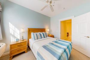 a bedroom with a bed and a ceiling fan at Efficient Getaway with Free WiFi - Close to Acadia National Park in Northeast Harbor