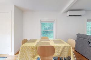 a dining room with a table and a couch at Charming Camden Retreat with Front Porch, Deck and Wifi in Camden +17 photos