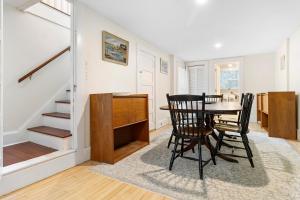 a dining room with a table and chairs at Bright, spacious getaway with full kitchen, furnished porch & WiFi - near trails in Seal Harbor +31 photos
