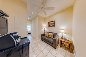 a living room with a couch and a tv at Two Neighboring Suites, Each w/ WiFi, Two TVs, and Central AC - Near Acadia in Northeast Harbor