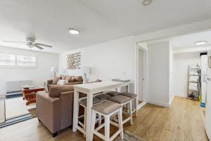 a living room with a couch and a table at Well-located, dog-friendly home - walk to footbridge & Barrett Park in Boothbay Harbor