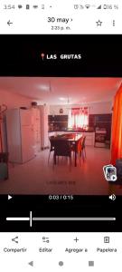 a television screen with a picture of a dining room at Arena & mar in Las Grutas +1 photo