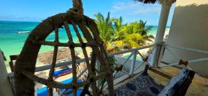 a view of the beach from the balcony of a resort at Equalia boutique hotel in Jambiani
