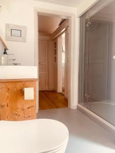 a bathroom with a tub and a toilet and a sink at Landhaus Börmoos in Steinberg +132 photos