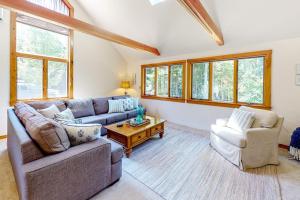 a living room with a couch and two chairs and a table at Dog-friendly beach house with WiFi, private washer/dryer, deck, beautiful views in Bristol