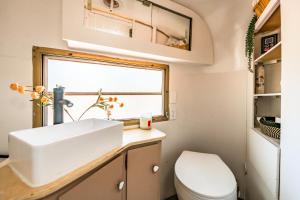 a small bathroom with a sink and a toilet at Ponderosa Pines Resort in Parks +34 photos