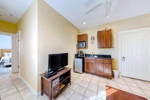 a living room with a tv and a kitchen at Two Neighboring Suites, Each w/ WiFi, Two TVs, and Central AC - Near Acadia in Northeast Harbor +15 photos