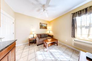 a living room with a couch and a table at Two Neighboring Suites, Each w/ WiFi, Two TVs, and Central AC - Near Acadia in Northeast Harbor