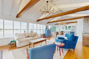 a living room with a couch and chairs and a table at 2 Waterfront Cottages in Ocean Point with Dock & Large Yard, Dog friendly in East Boothbay +45 photos