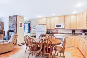 a kitchen with a table and chairs and a couch at Dog-friendly home in great locale close to the ocean with yard, streaming, W/D in Tremont