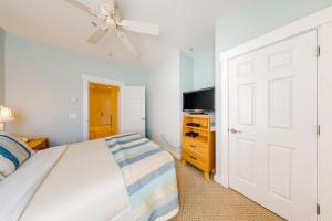 a bedroom with a bed and a ceiling fan at Efficient Getaway with Free WiFi - Close to Acadia National Park in Northeast Harbor +8 photos