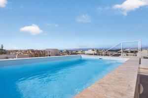a swimming pool on the roof of a building at Stylish Penthouse with private Pool andJacuzzi in Naxxar
