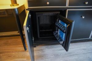 a microwave oven with its door open in a kitchen at Horizon Inn Norcross in Norcross +32 photos