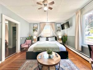 a bedroom with a bed and a table at King Bed 2BR near the LaHave River and Trails in Bridgewater