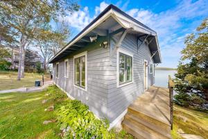 a tiny house with a porch and a lawn at 2 Waterfront Cottages in Ocean Point with Dock & Large Yard, Dog friendly in East Boothbay