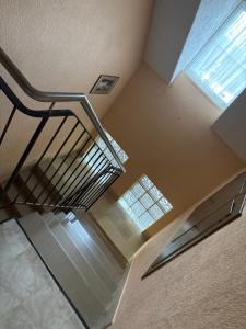 a spiral staircase in a building with a window at Gutsweinschänke & Pension Müllers in Kröv
