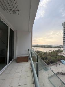 a balcony of a building with a view of a river at The Lake view Timber House in Hyderabad