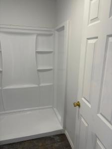 a white closet with an open door at Royal Motel in Allentown