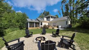 a backyard with chairs and a fire pit at Prairie View in Sawyer