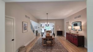 a living room with a dining room table and a hallway at Prairie View in Sawyer