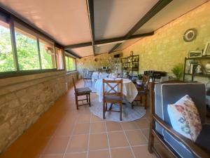 a dining room with a table and chairs at Casa Do Conde in Caldas de Reis