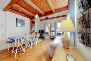 a dining room and living room with a table and chairs at Home with deck, great location in the heart of Acadia National Park in Otter Creek