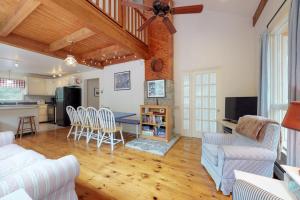 a living room with a table and chairs and a kitchen at Home with deck, great location in the heart of Acadia National Park in Otter Creek