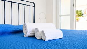 Llit o llits en una habitació de Cataldo Guest House