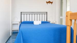 Llit o llits en una habitació de Cataldo Guest House