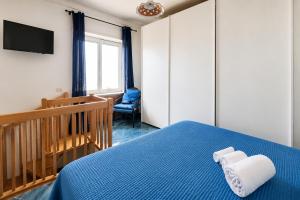 Llit o llits en una habitació de Cataldo Guest House
